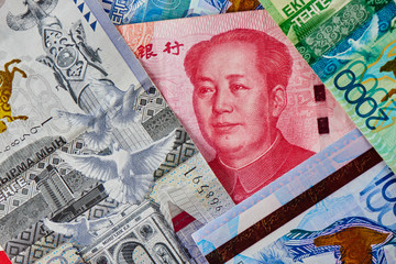 Chinese money Yuan and Kazakh tenge. Currency exchange concept, rise and fall in the business market