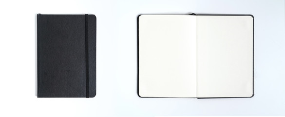 Notebook mock up with clean black blank for design and advertising. Notepad with chromed spring and free copy space template. On the gray background.