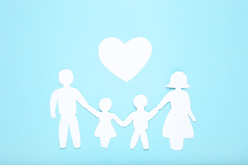 Family figures with heart on blue background