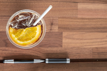 coffee orange juice and green straw