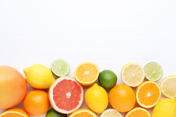Citrus fruits on white wooden table