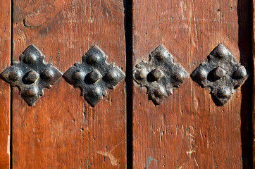 Old wooden door whit iron fittings