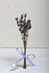 Lavender bouquet wrapped tied with a ribbon tied to a bow.