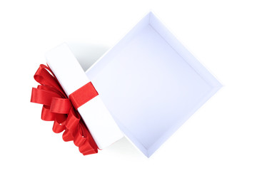 Open gift box with red bow isolated on white background