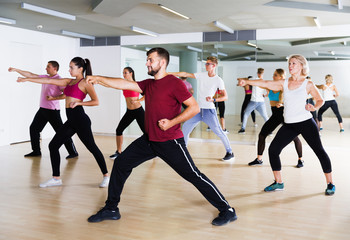 Fototapeta na wymiar People training at dance class