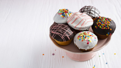 Decorated cupcakes on white table