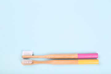 Bamboo toothbrushes on blue background