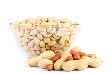 Peanuts in glass bowl isolated on white background