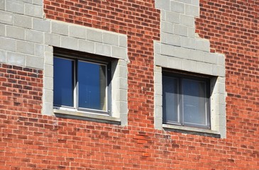 Two Windows in Brick Wall