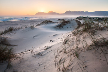 Wide angle landscape image over sand dunes outside the overberg holiday town of Hermanus in the...