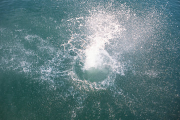 big splash in lake water view from above