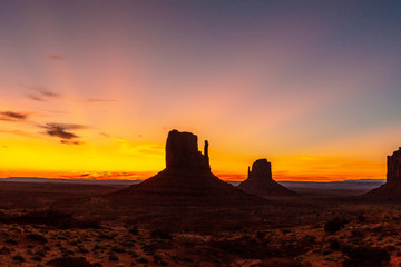 First pink sunrise lights at Monument Valley in the beautiful August sunrise, Utah