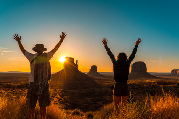 Fototapeta premium A lifestyle couple at dawn in Monument Valley, Utah