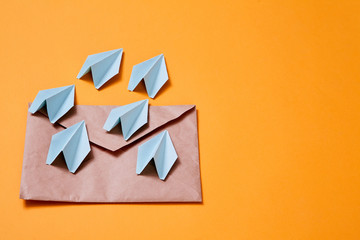 Concept for sending e-mails and e-commerce business. Email marketing. Paper planes flying out of...