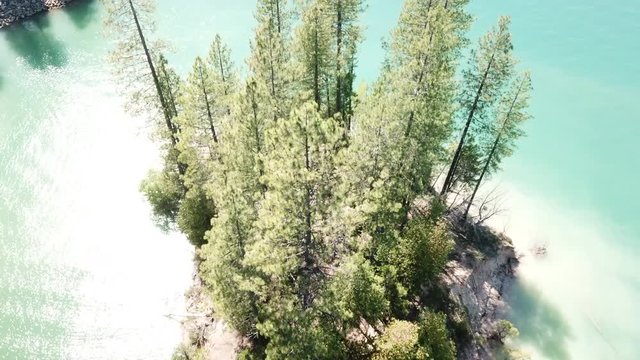 Drone passing over bleached island