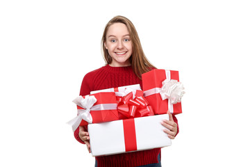 Young girl with gift boxes isolated on white background