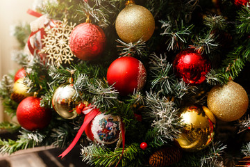 Christmas concept, lovely decorated Christmas tree, red glitter ball close up