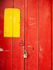 barricaded bright red wooden door locked with a chain and a door look6
