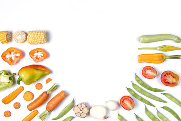 Creative layout made of haricot, tomatoes, pepper, carrot, garlic, maize, zucchini and onion....