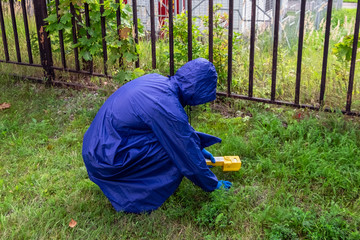 increasing the background radiation in the air and the ground, a researcher with a dosimeter...