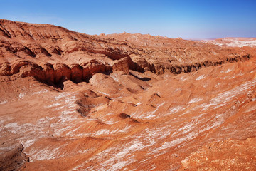 Desert landscape of the Moon Valley in red and orange colors near San Pedro de Atacama, in the...
