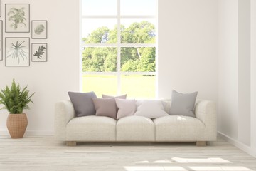 Stylish room in white color with sofa and summer landscape in window. Scandinavian interior design. 3D illustration