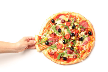 Female hand takes a piece of pizza, isolated on white background