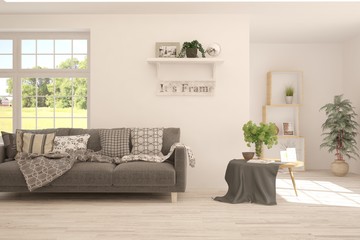 Stylish room in white color with sofa and summer landscape in window. Scandinavian interior design. 3D illustration