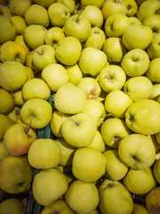 Ripe apples in the market. Autumn harvest concept, organic food, fruits. An abundance of fruit.