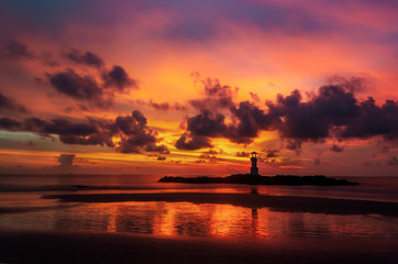 Fototapeta na wymiar Iconic lighthouse with sunset twilight atmosphere and beautiful colorful sky after sunset.