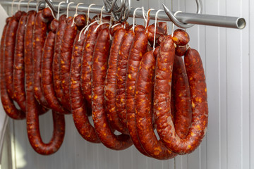 Chorizos cured and hung in strings (sausages)