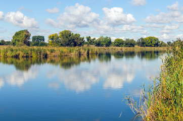 Beautiful summer landscape with a river and blue sky.