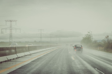 misty road during rainy day