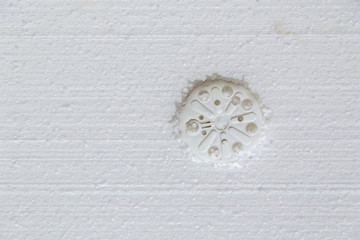 Foam plastic board styrofoam on a building wall for better insulation, soundproof and energy efficiency. Home Improvement background concept with copy space.