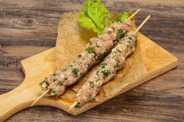 Raw minced pork skewer kebab for grill