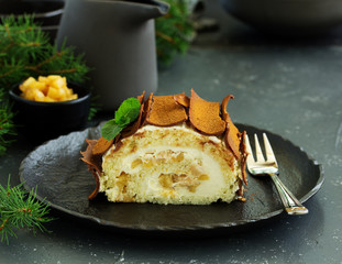 Roulade with apples and caramel, cream. New Year's dessert. Selective focus