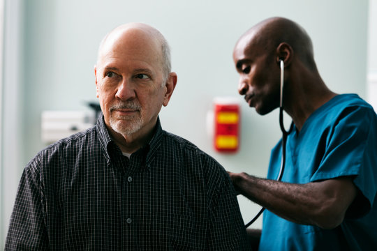 Exam: Doctor Uses Stethoscope During Adult Man's Exam