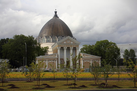 Moscow, Russia, The Geology pavilion at VVC on the background of the dome of the Cosmos pavilion at VDNKH summer day