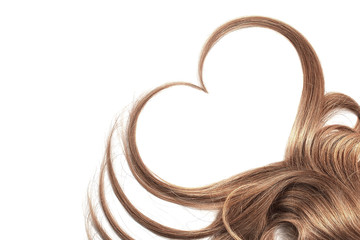 Brown hair in shape of heart isolated on a white background
