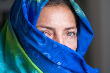 Portrait of woman wearing a colorful scarf