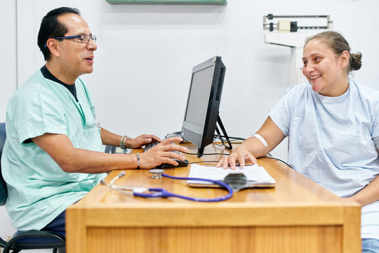 Doctor Explaining A Procedure To A Female Patient