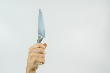 hand with knife on White background with space for text
