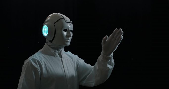 Slow motion of futuristic innovative technology system augmented reality ai cyber robot is using a futuristic interface for copy space isolated on a black background.