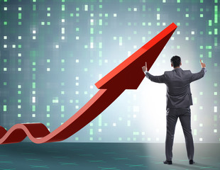 Businessman supporting growtn in economy on chart graph