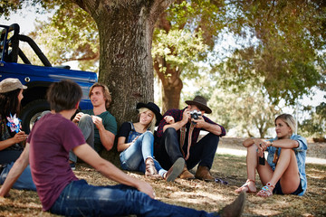 Man taking photo while on a road trip with friends