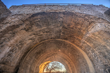 arched concrete tunnel under railroad overpass, Matfield Green, Kansas