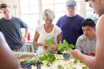 College football players volunteering to help at a flower farm