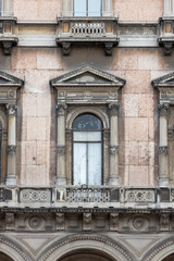 Fototapeta na wymiar ancient balcony with arched window door with columns, europe