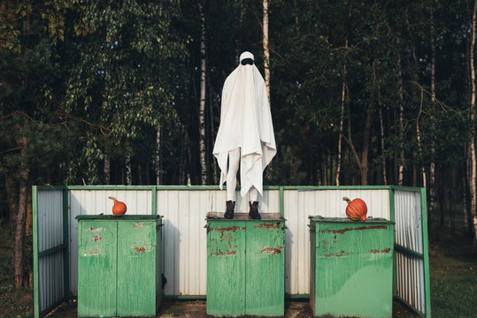 Ghost standing on garbage bin