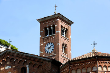 chiesa stile romanico campanile con orologio  Milano Italia Europa